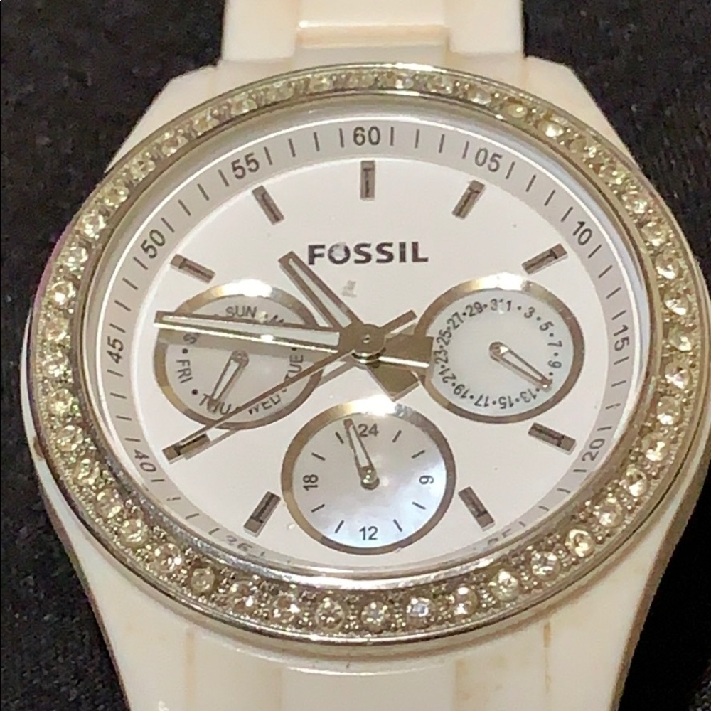 White women’s Fossil watch.